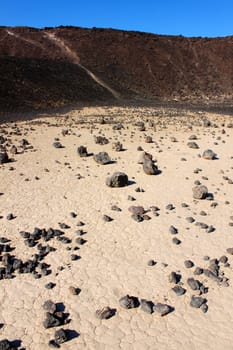 Volcanic rock scatters the center of Amboy Crater in the deserts of southern California.