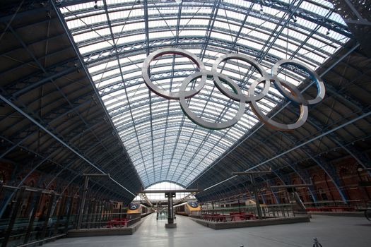 London, United Kingdom - June 8, 2011: The Olympic rings at St Pancras International Rail Station on June 8, 2011. This station is the terminus of trains in the UK and in France with Eurostar. The huge Olympic rings greet passengers in preparation for the London 2012 Olympics.