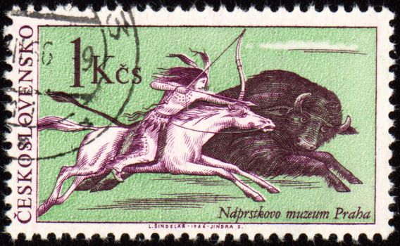 CZECHOSLOVAKIA - CIRCA 1966: stamp printed in Czechoslovakia, shows American Indian on horseback, pursue a bison galloping, 

circa 1966