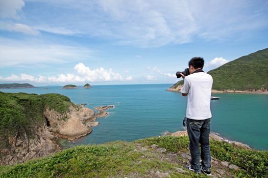 photographer takes a photo of the landscape 