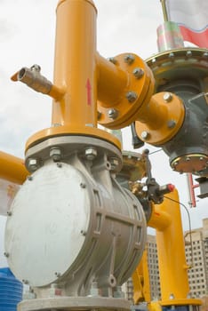 yellow gas pressure regulator with a crane and gear 