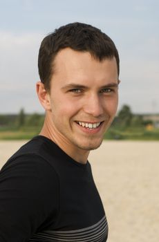 Portrait of young handsome smiling man 