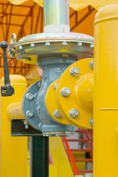 yellow gas pressure regulator with a crane and gear 