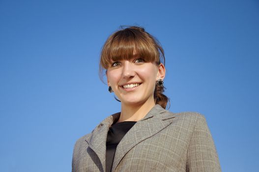 portrait businesswoman, blue sky background