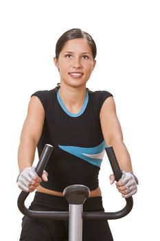 Portrit of a girl riding a fitness bicycle.