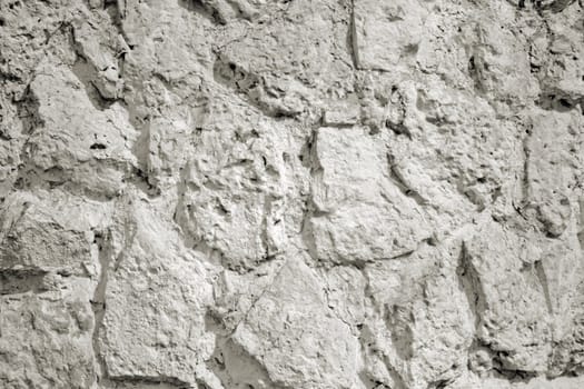 The close-up of a white stone wall for texture or background