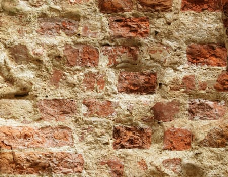 The close-up of an old brick wall for texture or background