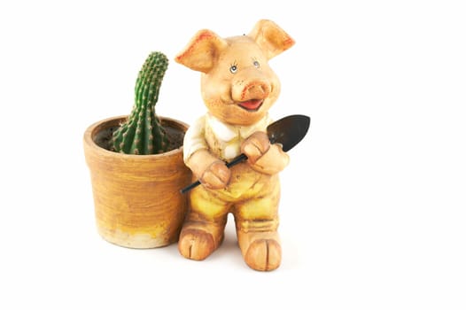 A flowerpot - a pig with a shovel on a white background