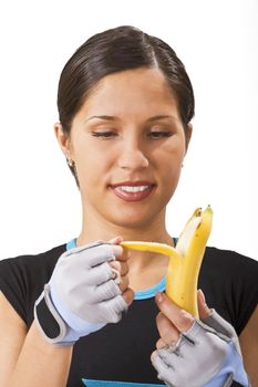 Soprtsgirl eating a banana during a training break.