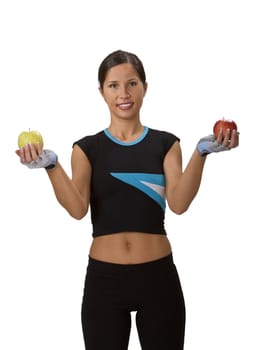 Young beautiful brunette holding apples against a white background.