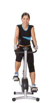 Smiling young woman riding a fitness bicycle isolated against a white background.