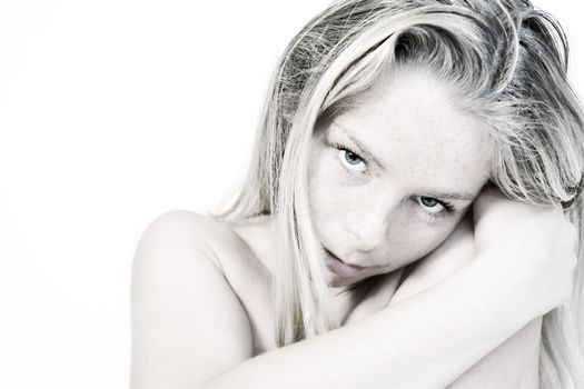 Studio portrait of a beautyfull blond model hugging herself