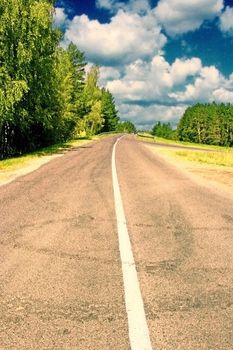 Road leaving afar a bright sunny day