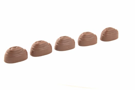 Sweets chocolate with a stuffing, on a white background