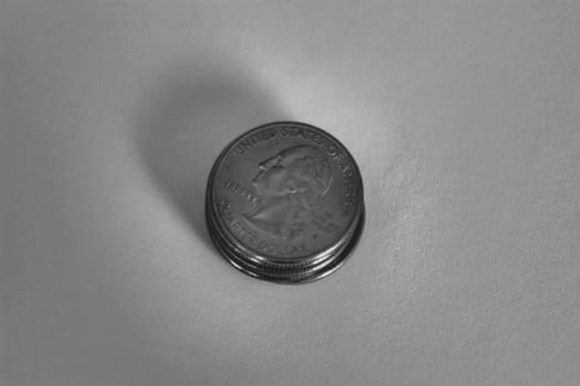 Stack of quarters shown in black and white