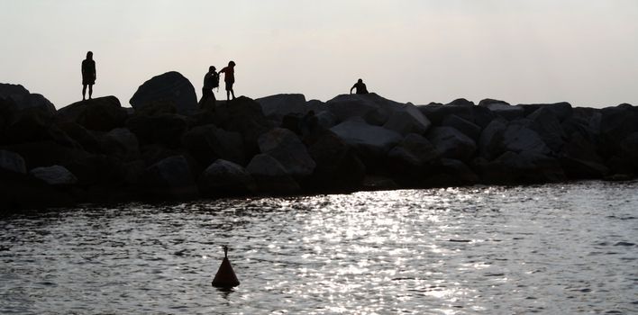 People on the dosch, shadows.