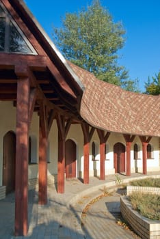 brick house with a wooden porch