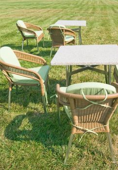 Patio furniture on green lawn