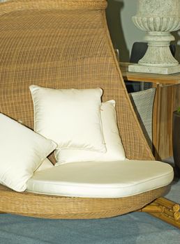 round wicker chair with cushions