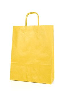 Yellow paper bag isolated on white background.