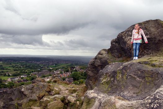 girls view from a rocky cliff in the Biddulph valley in the county of Staffordshire in England