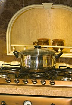 
Metal pan standing on the gas stove