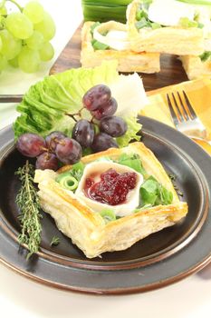 Goat cheese tartlets with spring onions, sour cream, cranberries and thyme