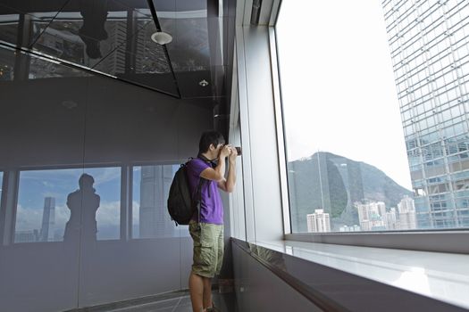 photographer takes a photo of the landscape indoor