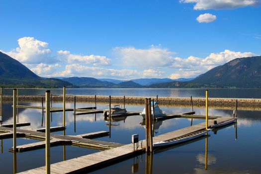 Small boats docked in Salmon Arm Lake, British Columbia Canada
