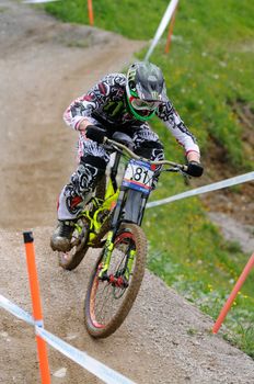 LEOGANG, AUSTRIA - JUN 12: UCI Mountain bike world cup. Participant at the downhill final race on June 12, 2011 in Leogang, Austria.