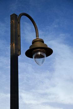 Image of street light on blue sky.