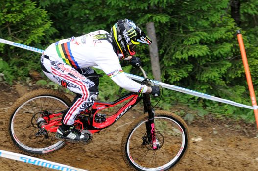 LEOGANG, AUSTRIA - JUN 12: UCI Mountain bike world cup. Participant at the downhill final race on June 12, 2011 in Leogang, Austria.