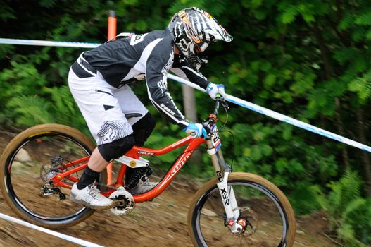 LEOGANG, AUSTRIA - JUN 12: UCI Mountain bike world cup. Thomas Braithewaite (GBR) at the downhill final race on June 12, 2011 in Leogang, Austria.