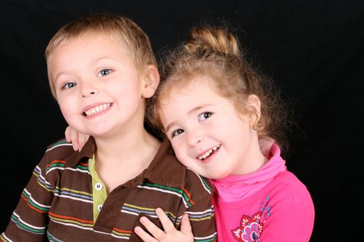 Beautiful young girl with curly hair and her cute boy friend
