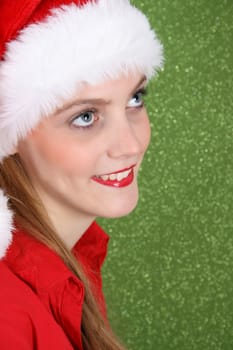 Teenager with red lips wearing a christmas hat