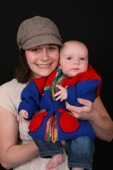 Beautiful mother and baby on a black background