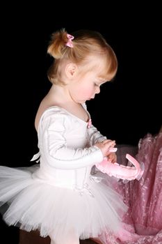 Little ballet toddler wearing a white tutu 