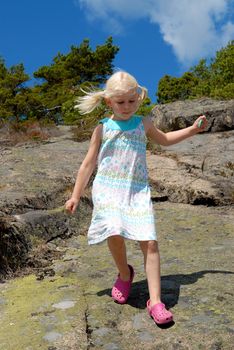 girl walking on stones. Please note: No negative use allowed.