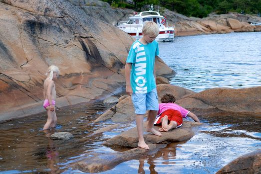 children swimming in the sea, norway. Please note: No negative use allowed.