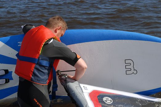 a man wears life jacket. Please note: No negative use allowed.