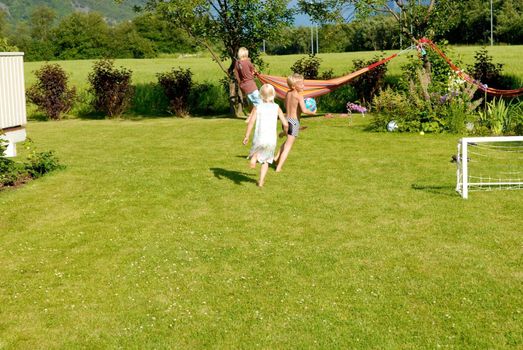 children playing in the garden. Please note: No negative use allowed.