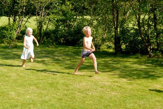 children playing in the garden. Please note: No negative use allowed.