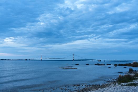 historic mackinaw bridge shot over lake michigan dark sky