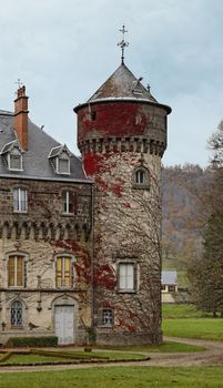 Autumn image of one of the towers of Sedaiges castle.This castle was built in the 12th century and is a unique example of Troubadour architecture of the 19th century.It is located in Auvergne province in south -central France.