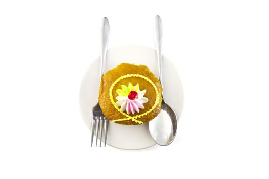 Cup cake and fork on white background