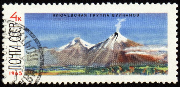 USSR - CIRCA 1965: stamp printed in USSR, shows mountain landscape with Kluchevskoj volcano in Kamchatka, 

circa 1965