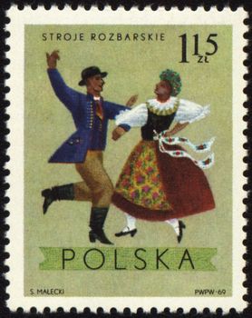 POLAND - CIRCA 1969: A stamp printed in Poland shows polish folk dancers in costumes from Rozbarskie region, series, circa 1969