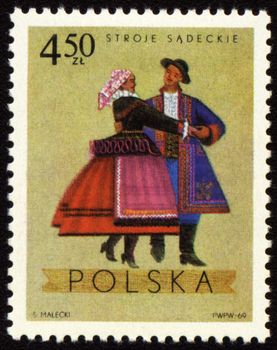 POLAND - CIRCA 1969: A stamp printed in Poland shows polish folk dancers in costumes from Sadecki region, series, circa 1969