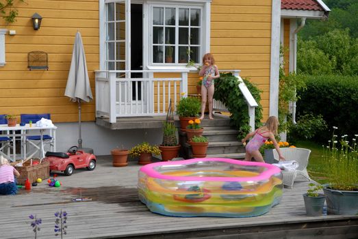 girls playing in the garden. Please note: No negative use allowed.