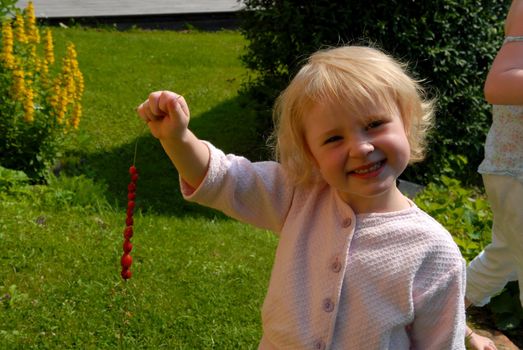 a happy girl with a bunch of fruit. Please note: No negative use allowed.